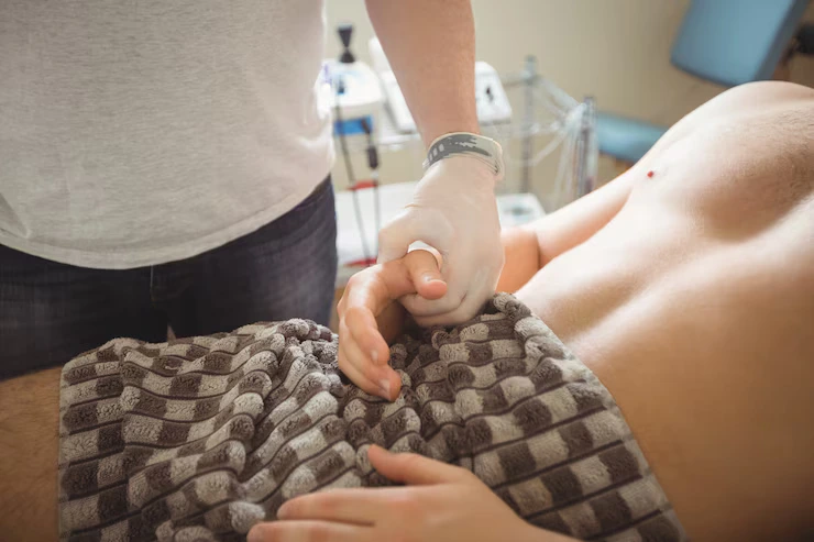 physiotherapist-examining-patient_107420-65801